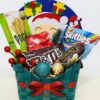 Christmas hamper with matcha biscuits, chocolates, and gummies in a green festive basket