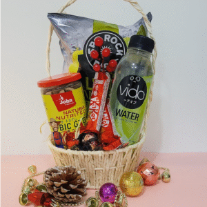 Gin Thye Celebration Cheers Hamper with sparkling non-alcoholic champagne, chips, chocolates, and snacks in a white willow basket