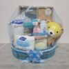Gin Thye Baby Joy Hamper (Blue) - Newborn Baby Shower Gift Blue baby hamper from Gin Thye featuring Muji baby gift set, Johnson & Johnson products, and baby essentials in a yellow oval basket
