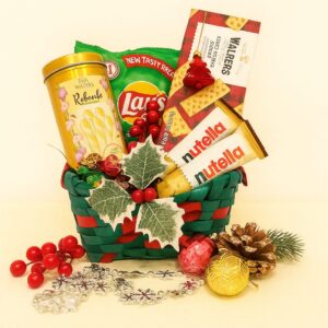 Gin Thye Festive Treats Hamper with chips, biscuits, and chocolates in a willow basket
