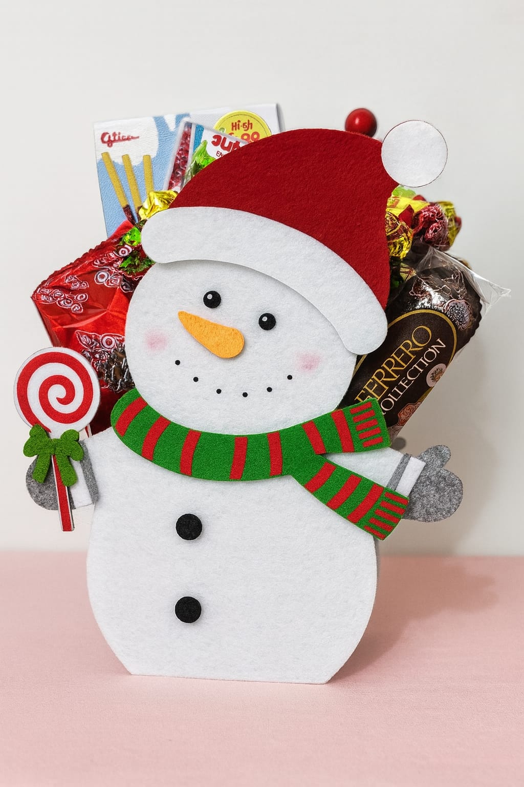 Christmas Snowman Treats Bag Snowman felt bag filled with chocolates, matcha biscuits, and gummies